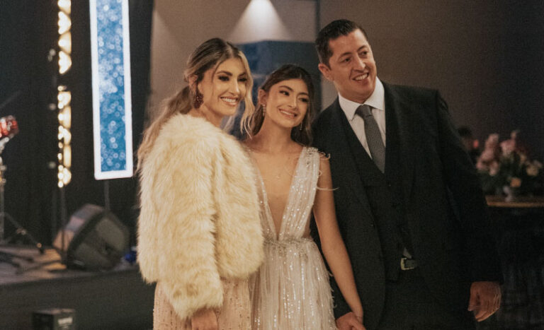 Teen girl wearing an elegant dress for quinceañera party as a guest