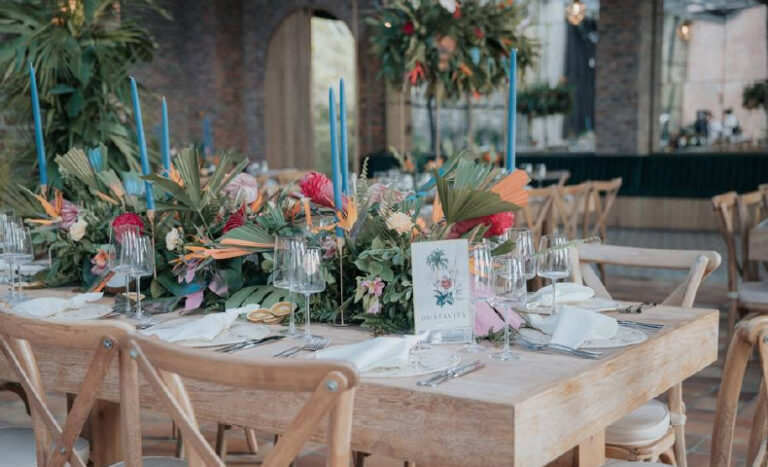 Wedding guest wearing black formal gown at night wedding